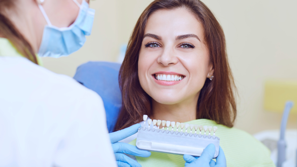 Woman Smiling with Dentist Choosing Tooth Shade – Professional Dental Utah